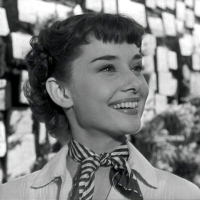 Audrey Hepburn smiles!